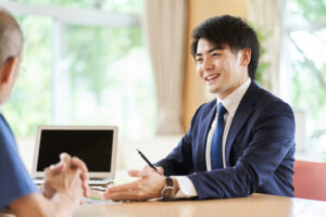 Young, male sales representative using physical presence as an advantage in selling.