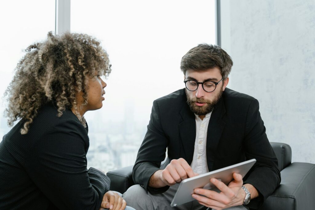 Two colleagues in discussion, illustrating opportunities for good entry-level jobs.