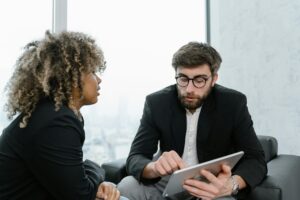 Two colleagues in discussion, illustrating opportunities for good entry-level jobs.